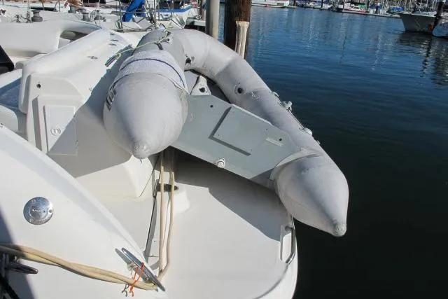 Slide: The Image of 2007 Sea Ray 340 Sundancer with inflatable dinghy on swim platform at marina. - 38