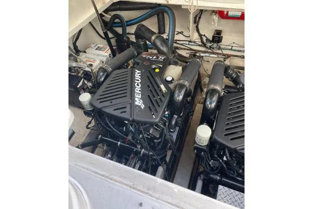 Slide: The Image of Engine compartment of 2007 Sea Ray 340 Sundancer with twin Mercury engines. - 42