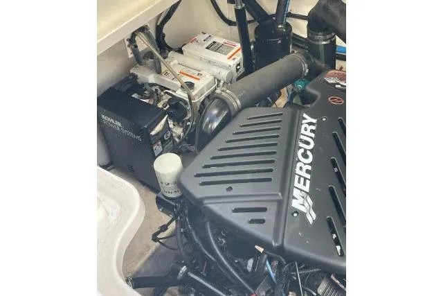 Slide: The Image of Engine compartment of a 2007 Sea Ray 340 Sundancer with Mercury components. - 43