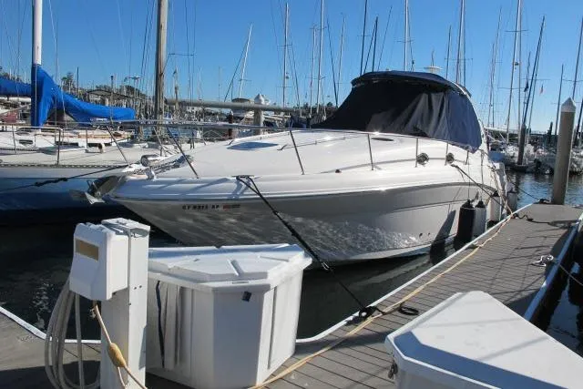 Slide: The Image of 2007 Sea Ray 340 Sundancer docked at marina with sailboats in background. - 49
