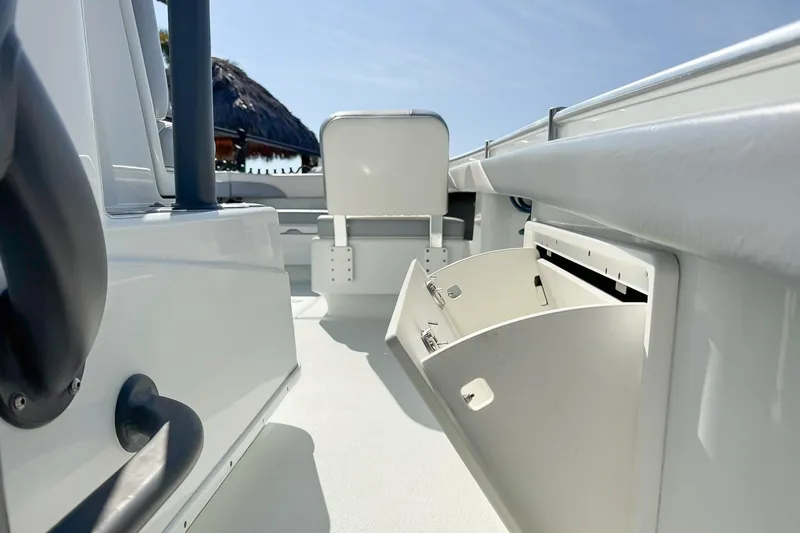 Slide: The Image of 2022 Yellowfin 26 Hybrid boat interior with open storage compartment. - 4