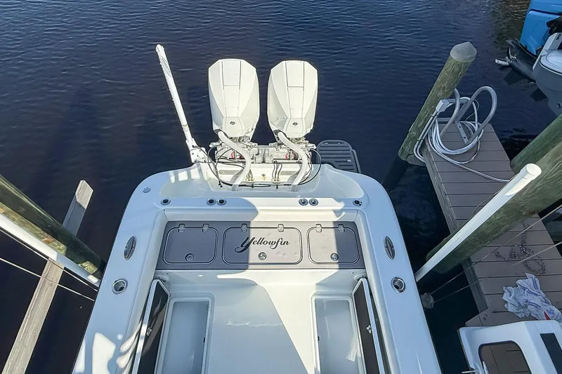 Slide: The Image of 2022 Yellowfin 26 Hybrid boat with dual engines docked at marina. - 5