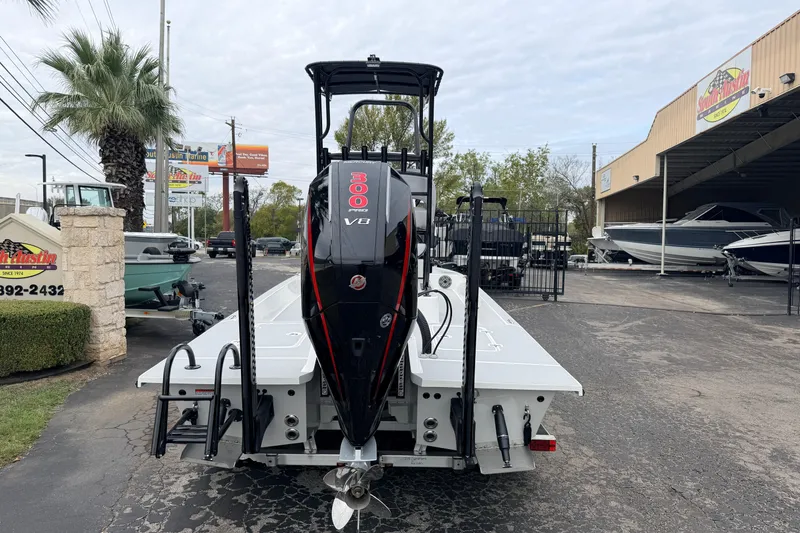 Slide: The Image of 2026 SCB R24 boat with powerful V8 engine displayed at a marine dealership. - 1