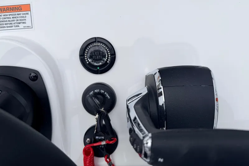 Slide: The Image of Control panel of SCB R24 boat, featuring throttle and warning label, 2026 model. - 12