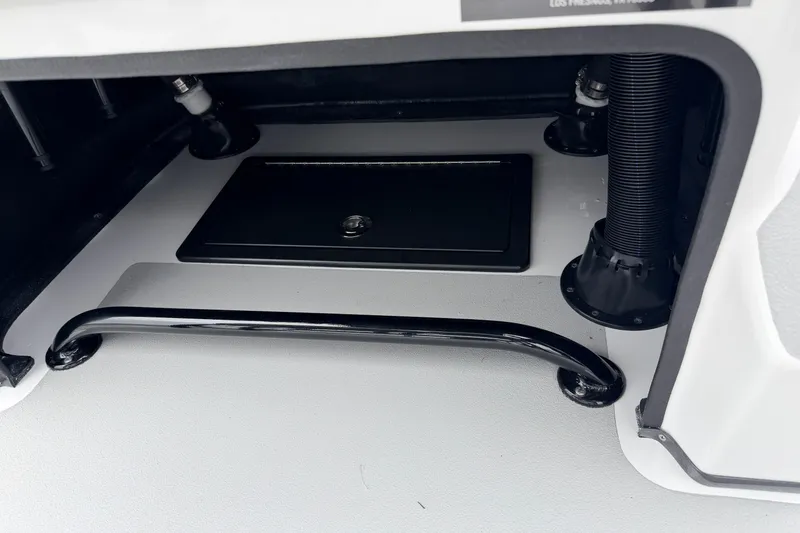 Slide: The Image of Storage compartment of 2026 SCB R24 boat, featuring secure latch and sturdy handle. - 20