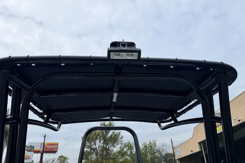 Slide: The Image of 2026 SCB R24 boat T-top with mounted light against cloudy sky. - 27
