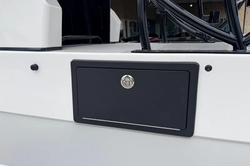 Slide: The Image of 2026 SCB R24 boat with a black storage compartment and sleek design. - 28