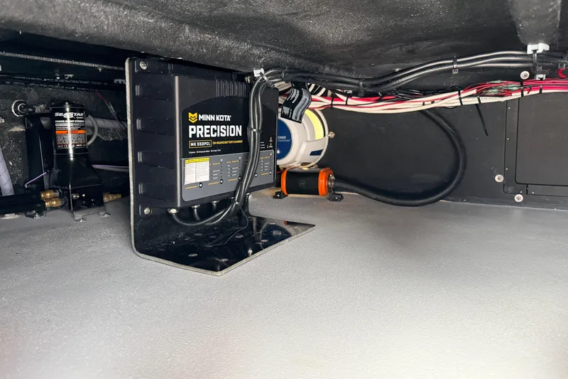 Slide: The Image of Underdeck view of SCB R24 2026 with Minn Kota Precision charger and wiring. - 30
