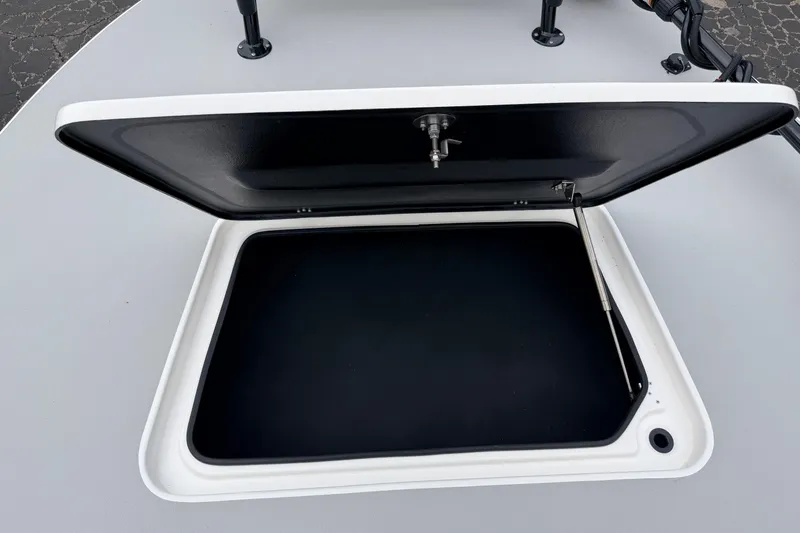 Slide: The Image of Open storage compartment on 2026 SCB R24 boat deck. - 32