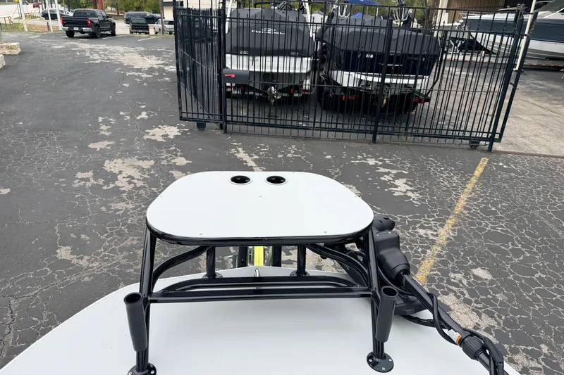 Slide: The Image of 2026 SCB R24 boat with elevated platform, parked near other boats. - 33