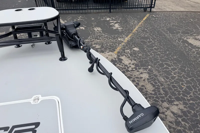 Slide: The Image of 2026 SCB R24 boat with Garmin trolling motor on a textured pavement background. - 34