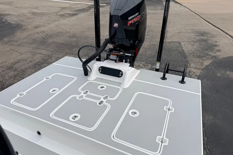 Slide: The Image of 2026 SCB R24 boat deck with Mercury Pro XS engine, featuring storage compartments. - 35