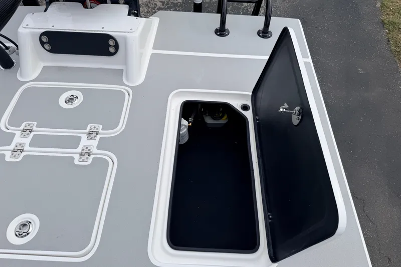 Slide: The Image of 2026 SCB R24 boat deck with open storage compartment and secure latches. - 36