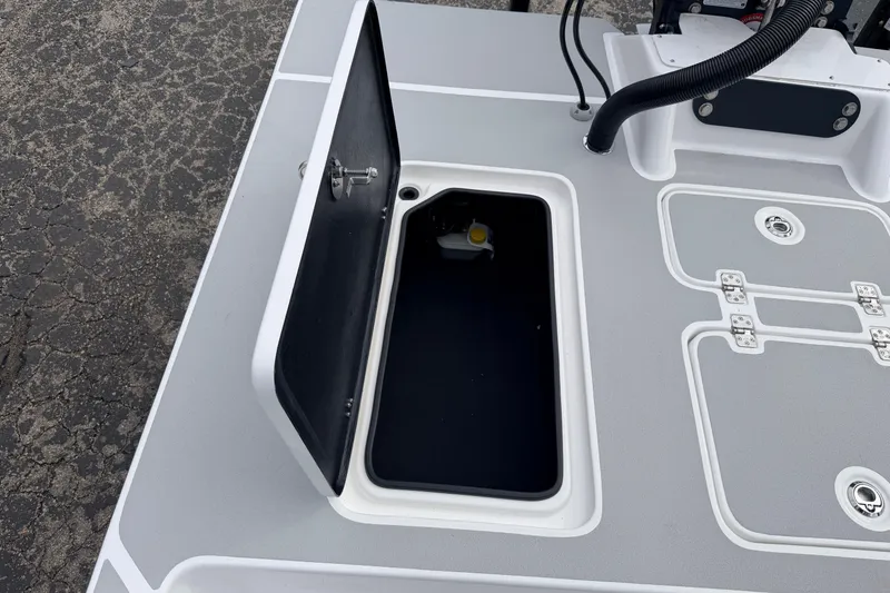 Slide: The Image of Open storage compartment on 2026 SCB R24 boat deck. - 38