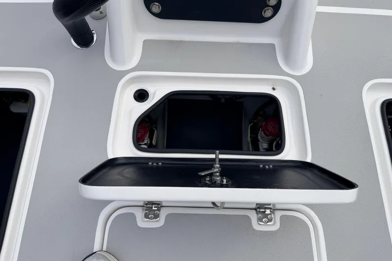 Slide: The Image of Open hatch on SCB R24 boat deck, showcasing storage compartment, 2026 model. - 39