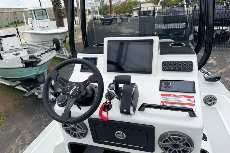 Slide: The Image of 2026 SCB R24 boat dashboard with steering wheel, touchscreen, and control panel. - 7