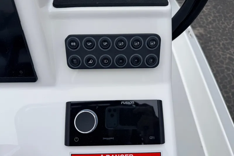 Slide: The Image of Control panel of 2026 SCB R24 boat with buttons and Fusion audio system. - 9