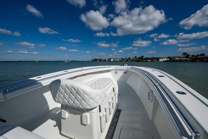 Slide: The Image of 2018 Yellowfin 36 Offshore boat on calm water under a blue sky with clouds. - 16