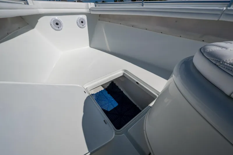 Slide: The Image of 2018 Yellowfin 36 Offshore boat interior with storage compartment and seating. - 19