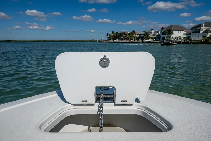Slide: The Image of 2018 Yellowfin 36 Offshore boat with open anchor hatch, scenic waterfront view. - 20
