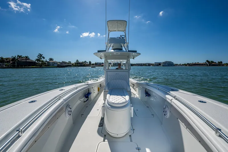 Slide: The Image of 2018 Yellowfin 36 Offshore boat cruising on a sunny day, with clear blue skies. - 22