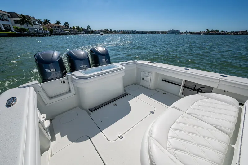 Slide: The Image of 2018 Yellowfin 36 Offshore boat with triple 300 horsepower engines on a sunny day. - 26