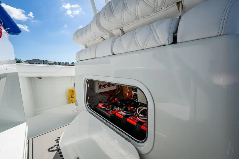 Slide: The Image of 2018 Yellowfin 36 Offshore boat with open battery compartment under cushioned seat. - 41