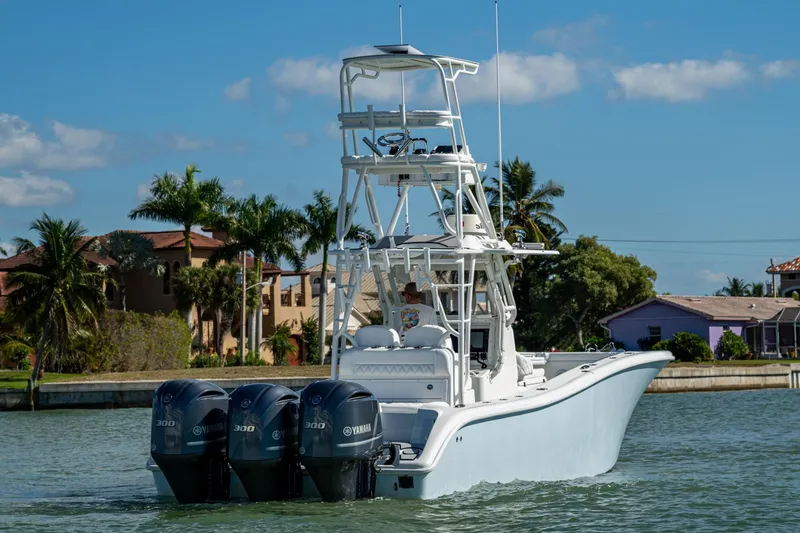Slide: The Image of 2018 Yellowfin 36 Offshore boat with triple Yamaha engines on a sunny day. - 55