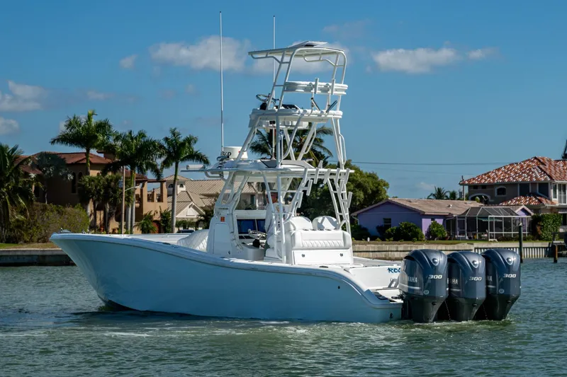 Slide: The Image of 2018 Yellowfin 36 Offshore boat with triple Yamaha engines on a sunny day. - 58