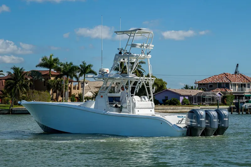 Slide: The Image of 2018 Yellowfin 36 Offshore boat with triple Yamaha engines on a sunny day. - 59