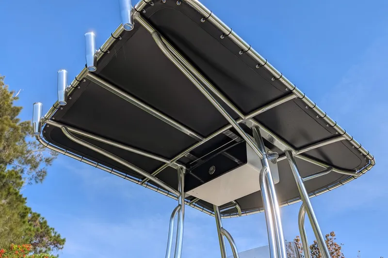 Slide: The Image of T-top of 2022 Key West 189 FS boat against clear blue sky. - 11