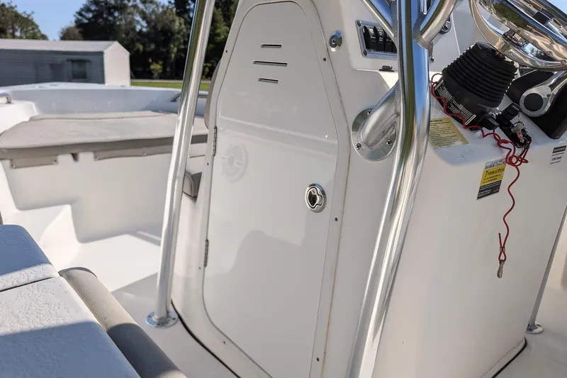Slide: The Image of 2022 Key West 189 FS boat interior with steering console and seating area. - 12