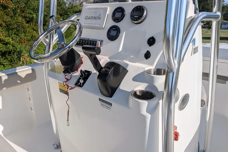 Slide: The Image of 2022 Key West 189 FS boat console with Garmin electronics and stainless steel steering wheel. - 5