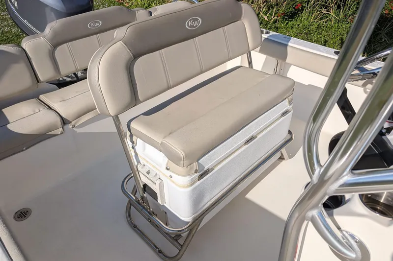Slide: The Image of 2022 Key West 189 FS boat interior with cushioned seating and storage. - 7