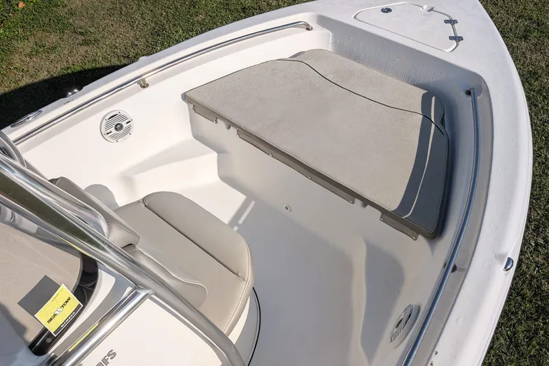 Slide: The Image of 2022 Key West 189 FS boat interior with cushioned seating and speaker. - 8