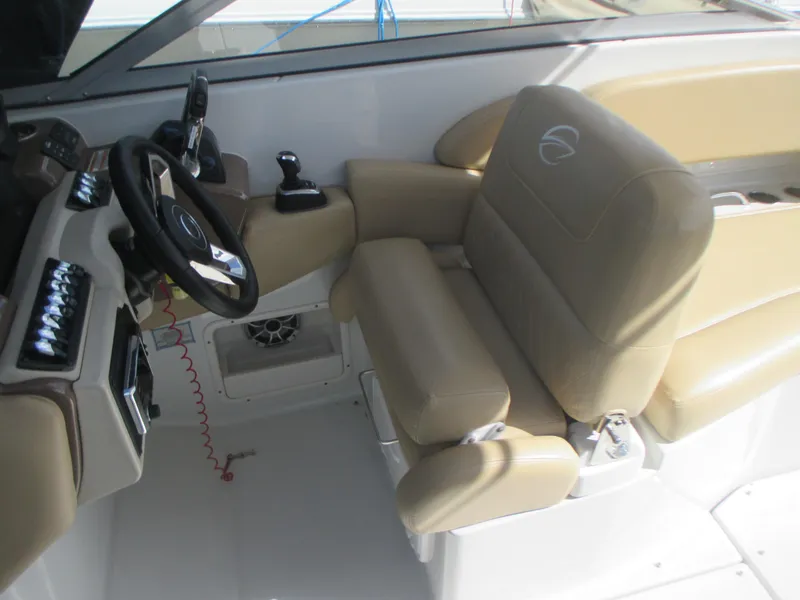 Slide: The Image of 2018 Crownline Eclipse E29 XS boat with dual engines and spacious seating at the dock. - 14