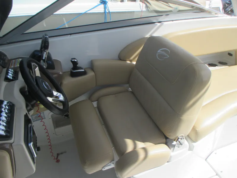 Slide: The Image of 2018 Crownline Eclipse E29 XS boat interior with beige seating and teak flooring. - 15