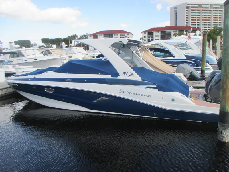Slide: The Image of 2018 Crownline Eclipse E29 XS boat with Yamaha engine on lift at marina. - 3