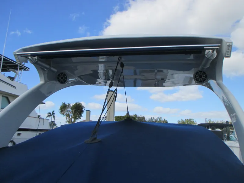 Slide: The Image of 2018 Crownline Eclipse E29 XS boat with covered deck and blue sky background. - 9