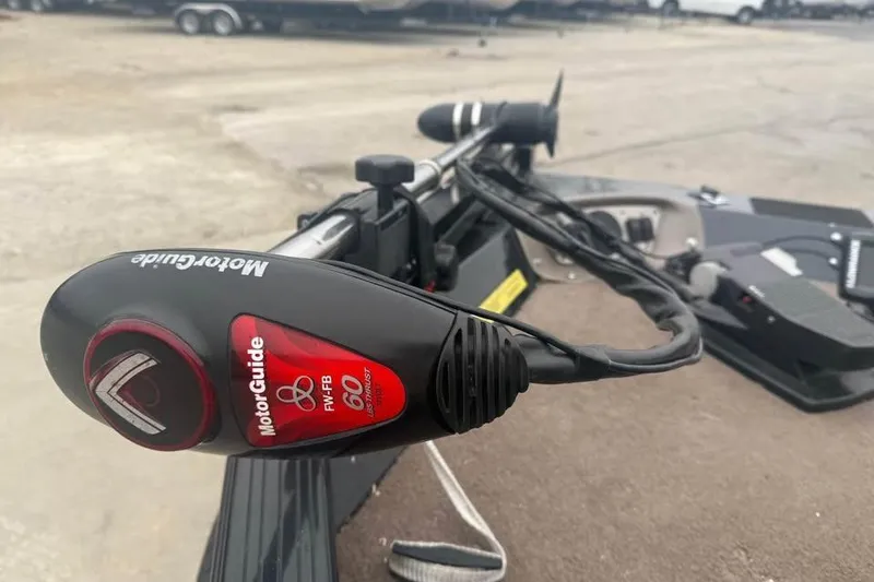 Slide: The Image of MotorGuide trolling motor on 2004 Express x17 boat, featuring 60-pound thrust. - 13