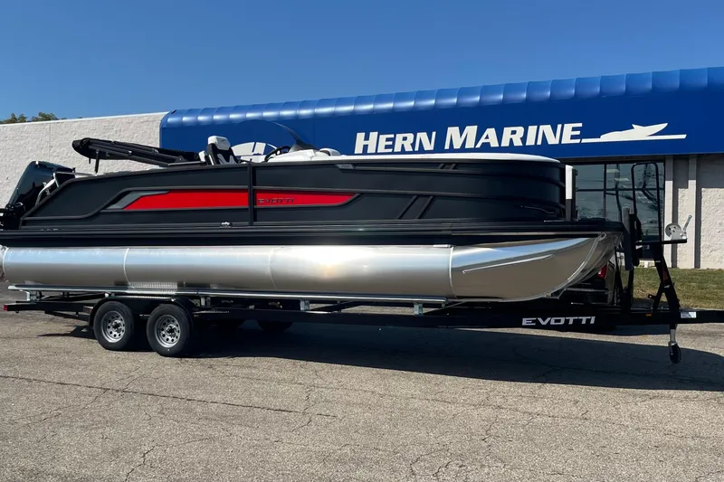The Image of 2026 Evotti 725CS pontoon boat on trailer at Hern Marine dealership. - 1