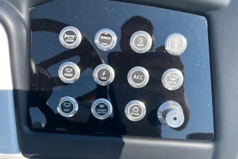 Slide: The Image of Control panel of 2026 Evotti 725CS boat with various function buttons. - 19