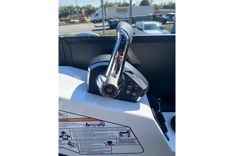 Slide: The Image of Close-up of Evotti 725CS boat throttle control, 2026 model, with start/stop button. - 26