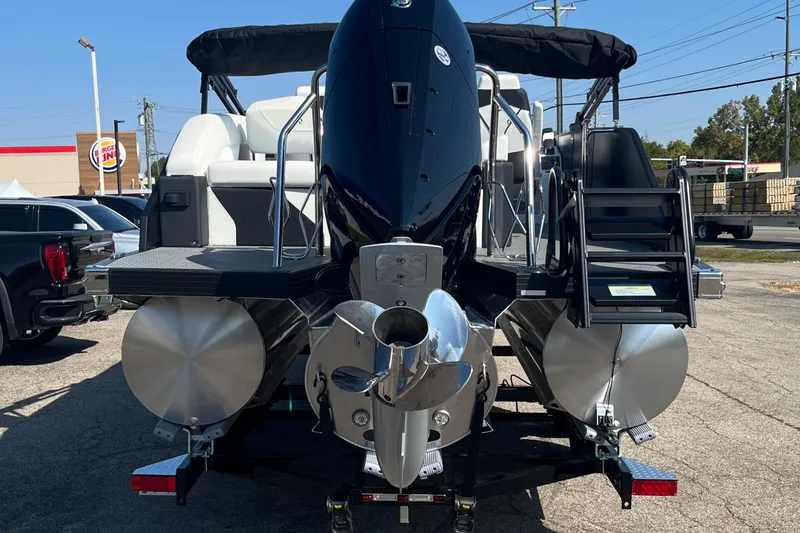 Slide: The Image of 2026 Evotti 725CS pontoon boat with powerful outboard motor, parked outdoors. - 29