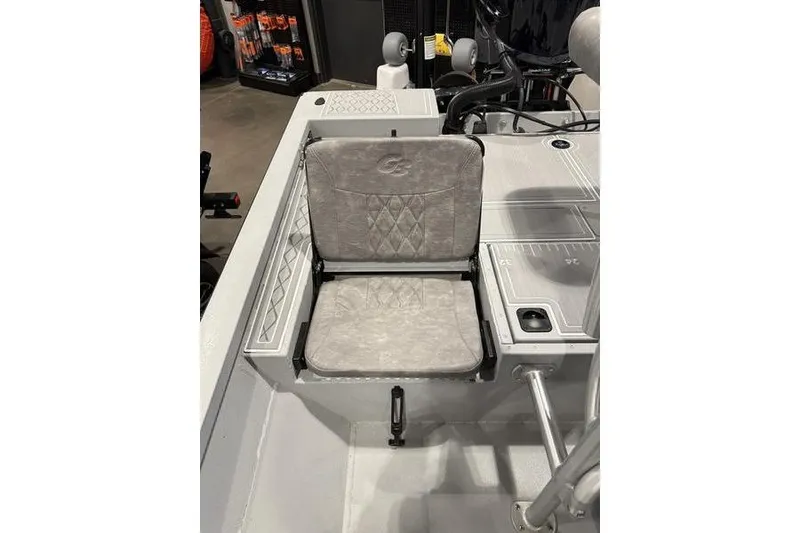Slide: The Image of 2026 G3 Bay 22 GX boat seat with diamond pattern upholstery and integrated storage. - 5