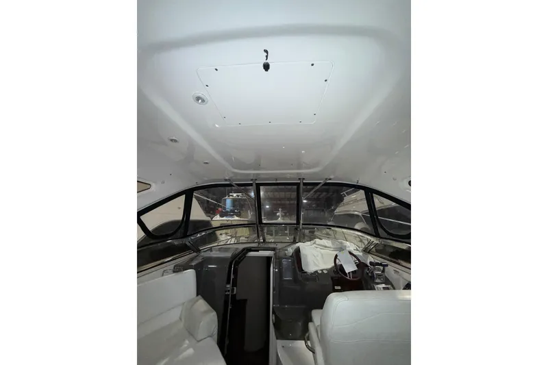 Slide: The Image of 2009 Regal Commodore 3760 IO dashboard with gauges and navigation equipment. - 11