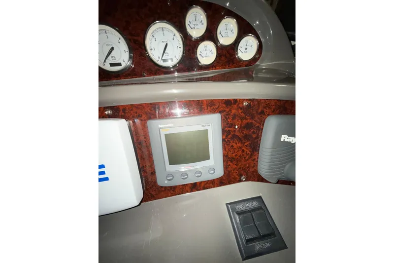 Slide: The Image of 2009 Regal Commodore 3760 IO dashboard with gauges and control panel. - 12