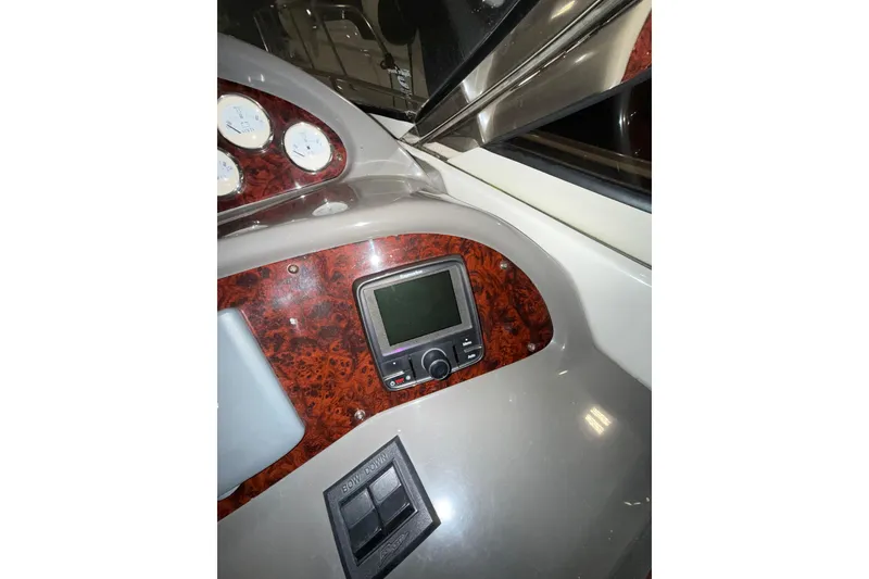 Slide: The Image of 2009 Regal Commodore 3760 IO yacht kitchen with microwave, fridge, and sink. - 15