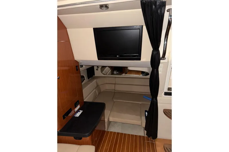 Slide: The Image of 2009 Regal Commodore 3760 IO bathroom with sink, mirror, and toilet. - 21