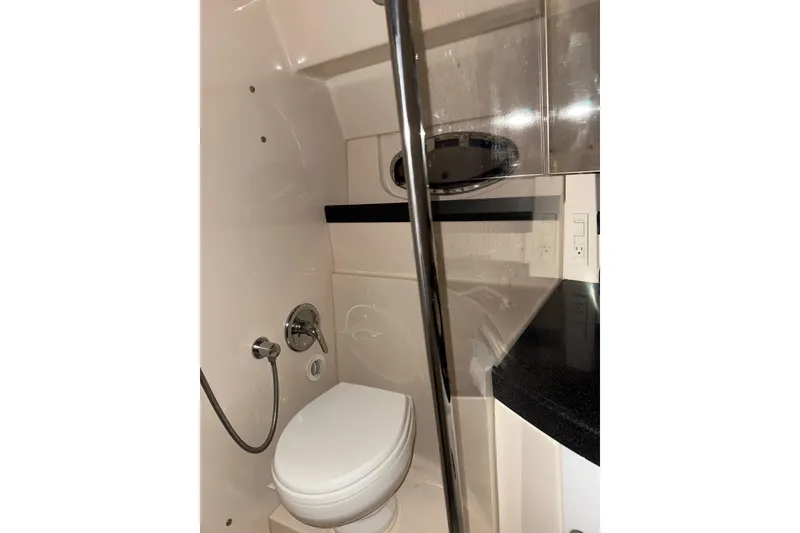 Slide: The Image of Engine room of 2009 Regal Commodore 3760 IO with visible components and equipment. - 22